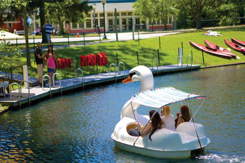 photo of swan boats at Roger williams park - link opens to roger williams park boating page