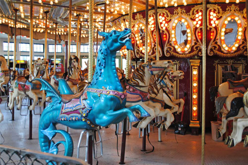 photo of carousel horses at Roger Williams Park Carousel Village - link opens to carousel village website