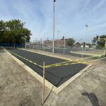 photo showing renovation work with basketball courts in the background