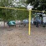 photo showing swings and playground structures