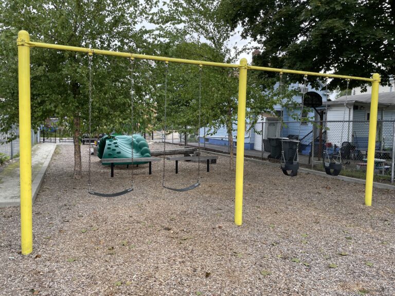 photo showing swings and playground structures