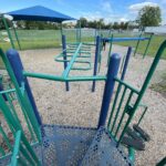 Hopkins Park playground overhead ladder and track ride