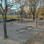 photo showing park benches and playground structures