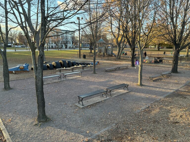 photo showing park benches and playground structures