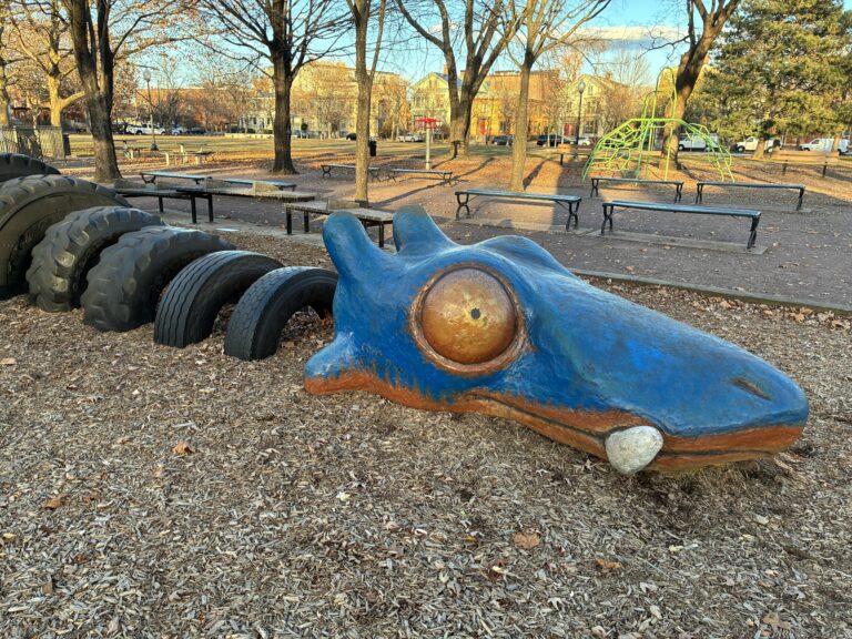 photo showing park benches and playground structures
