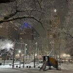 photo showing snow that had recently fallen on the playground at Burnside park at night