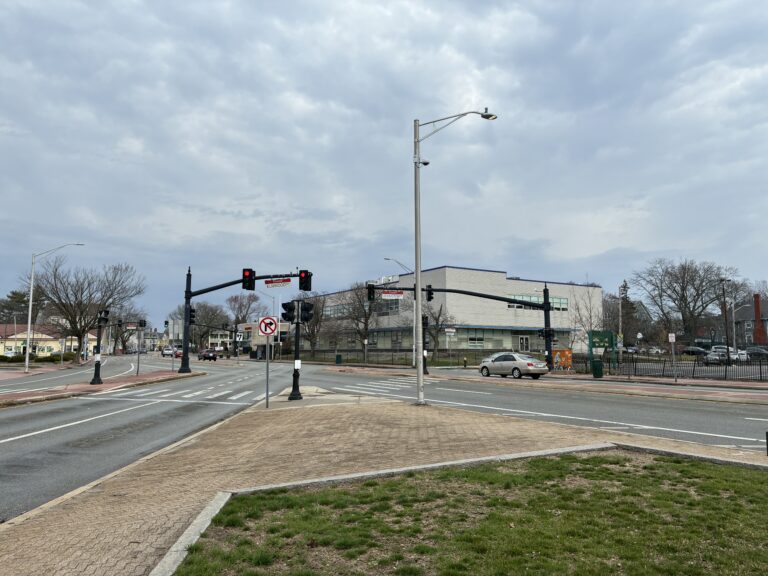 photo showing a street intersection and sidewalks
