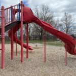 photo showing a playground structure with a slide