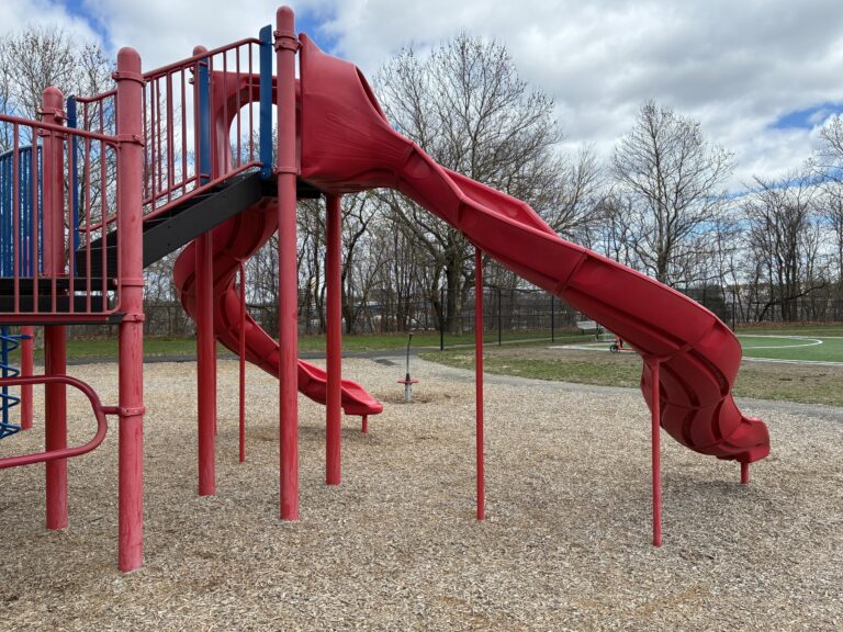 photo showing a playground structure with a slide