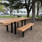 photo showing trees and picnic tables