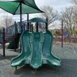 photo showing a playground structure with slides