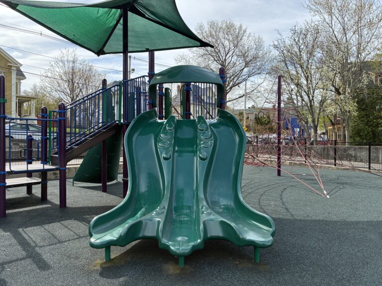 photo showing a playground structure with slides