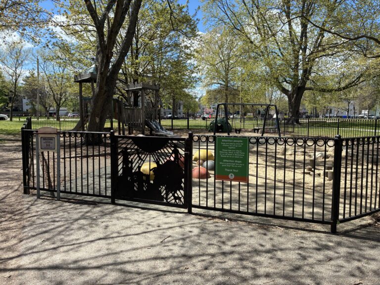 photo showing fenced in playground structures