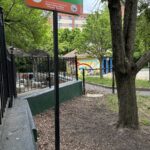 A photo showing a tree and a sign for Cabral Park