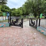 A photo showing the gates to Cabral park. On the gates it reads "Fox Point"
