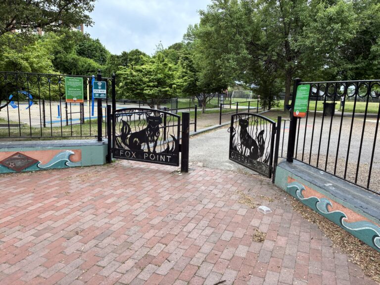 A photo showing the gates to Cabral park. On the gates it reads "Fox Point"