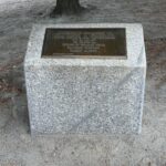 a photo showing a memorial plaque for Paul Cabral