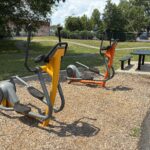 photo of exercise equipment and a picnic table