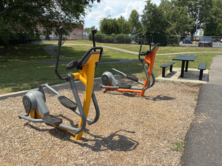 photo of exercise equipment and a picnic table