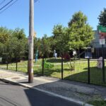photo showing a fence around the playground