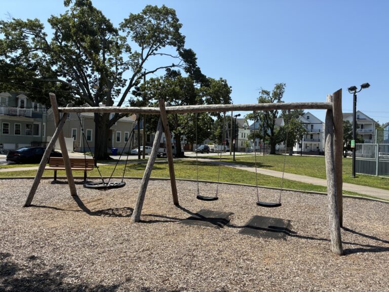 photo of a wooden swing set