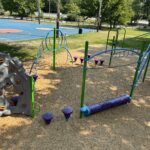 Merino Park sprawling play structure for ages 5-12 viewed from atop the spiral slide