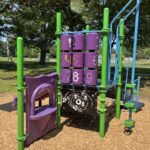 Merino Park play structure for ages 2-5 renovated in 2026 with activity panels, slide, and climber