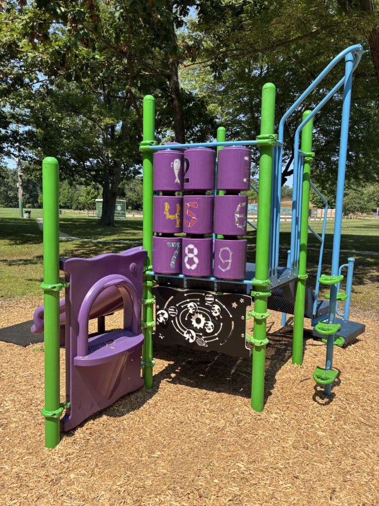 Merino Park play structure for ages 2-5 renovated in 2026 with activity panels, slide, and climber