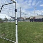 photo showing a sports field and net