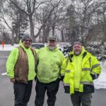 Providence Forestry team photo in Roger Williams Park with freshly fallen snow coating the trees