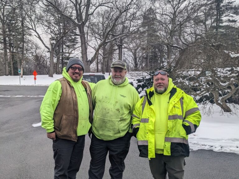 Providence Forestry team photo in Roger Williams Park with freshly fallen snow coating the trees