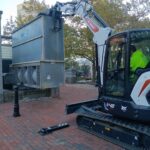 Parks crew removing old chiller for City Center Rink- now turned into a performance stage at Biltmore Park