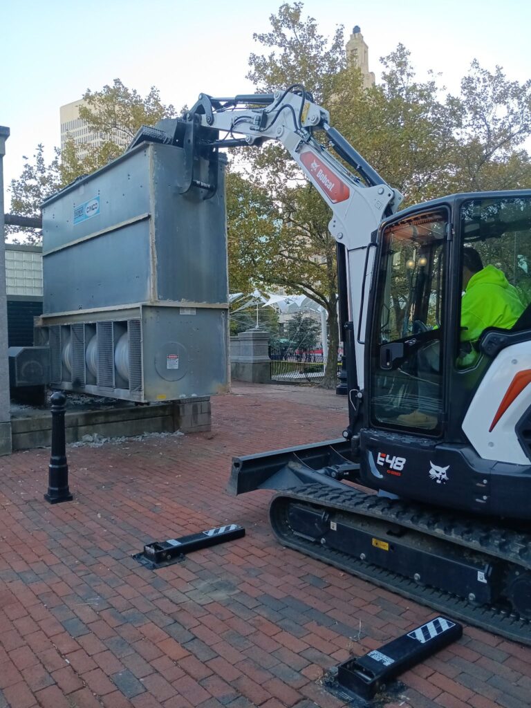 Parks crew removing old chiller for City Center Rink- now turned into a performance stage at Biltmore Park