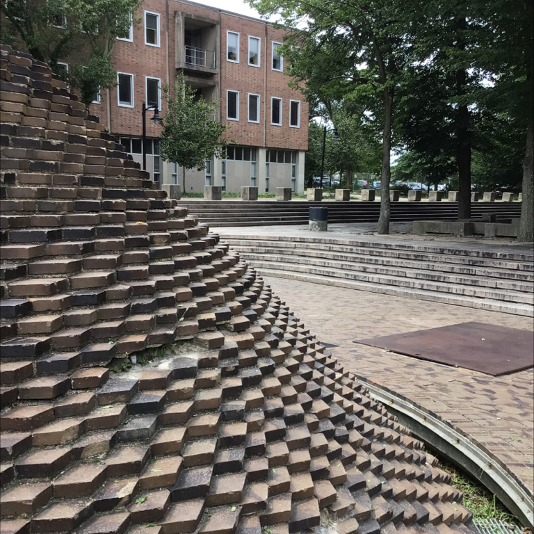 photo showing a defunct fountain and steps