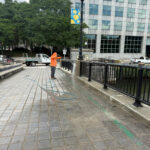 Parks team pressure washing Crawford St Bridge - Providence River Park