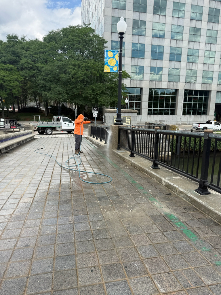 Parks team pressure washing Crawford St Bridge - Providence River Park