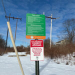 photo of power lines and a sign that says the property is owned by the City of Providence
