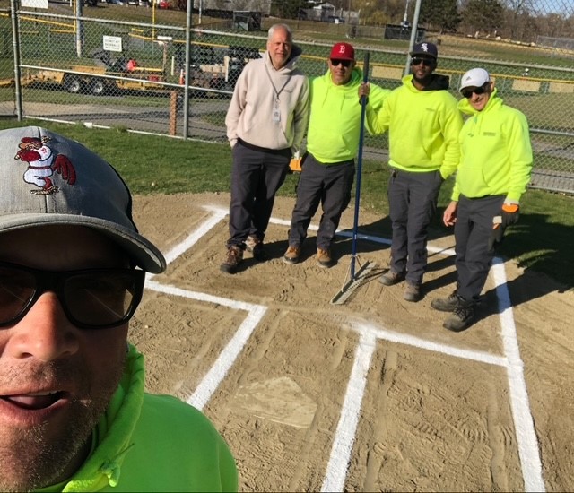 Parks ballfield crew selfie from behind the plate at JT Owens Park softball field