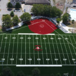 photo showing a birds eye view of a baseball field, football field, swimming pool, basketball courts, and splashpad