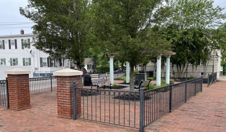 photo showing a small urban park and gazebo