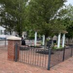 Photo showing fenced in seating areas of Cerbo Square