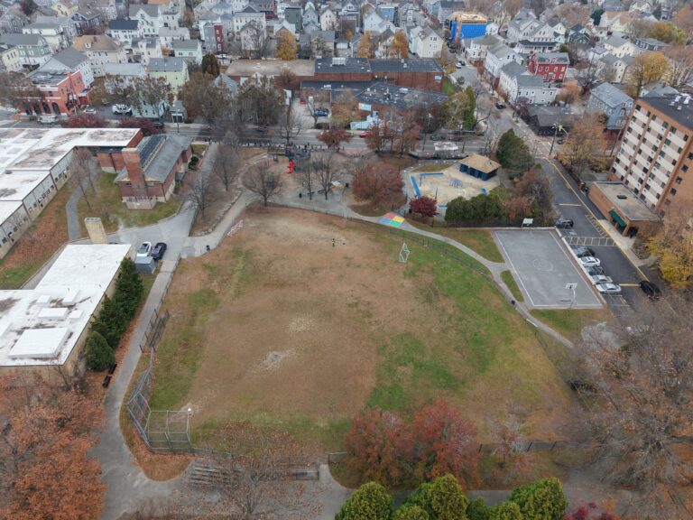 birds eye view of a baseball field, playground area, and basketball court
