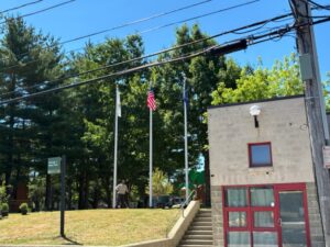 George J West Park Chalkstone Ave entrance with monument and flags