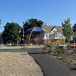 Photo showing playground structures at Harriet & Sayles Park