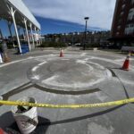 photo showing a construction area with orange cones and caution tape