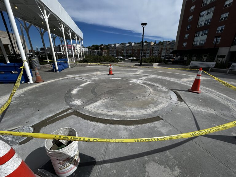 photo showing a construction area with orange cones and caution tape
