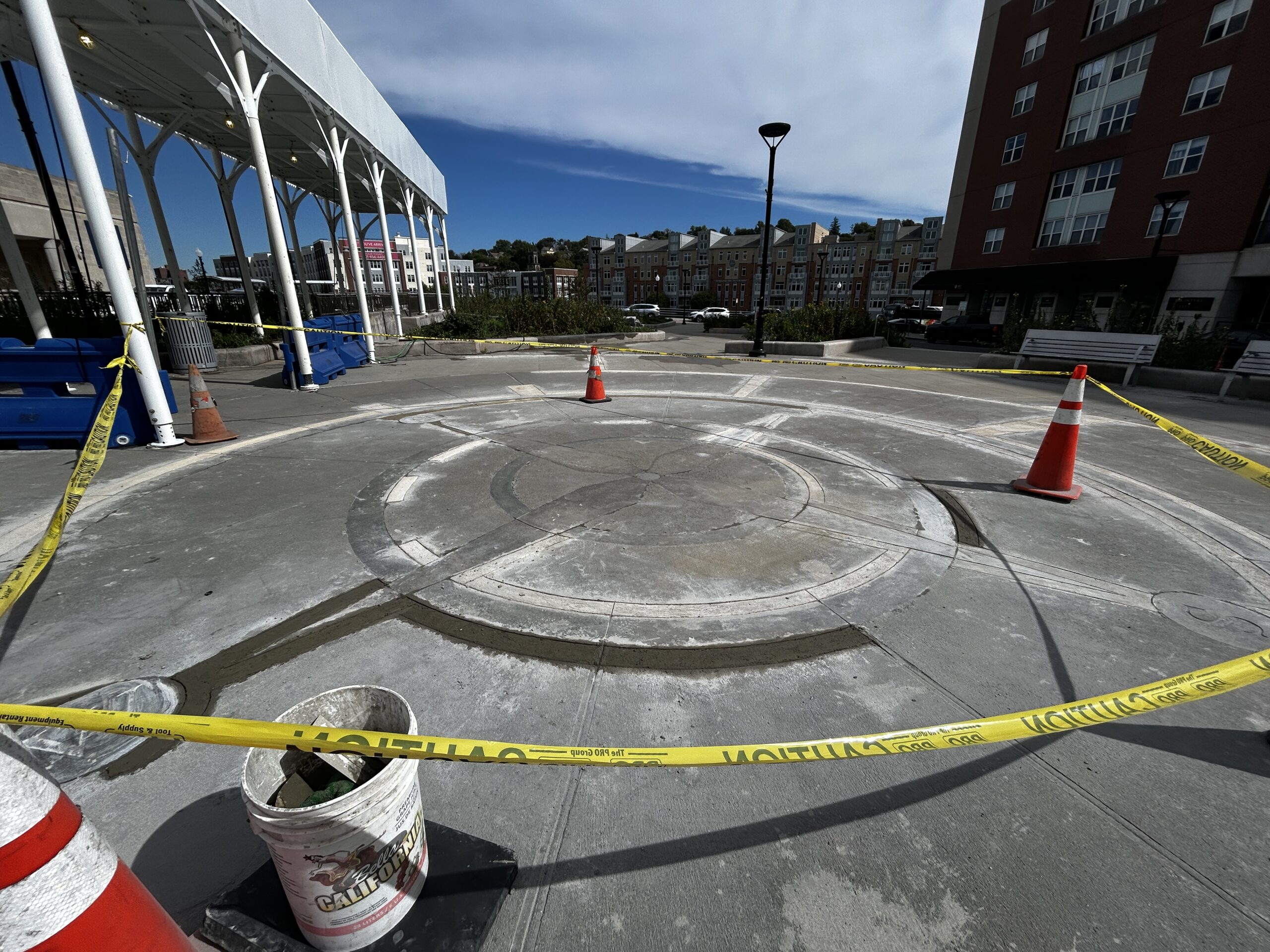 photo showing a construction area with orange cones and caution tape