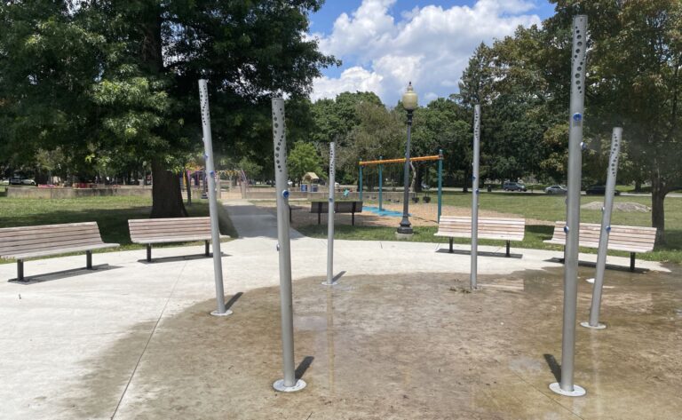 Photo showing water misters and playground structures at Lippitt Park