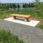 Photo showing a park bench at Mashapaug Park