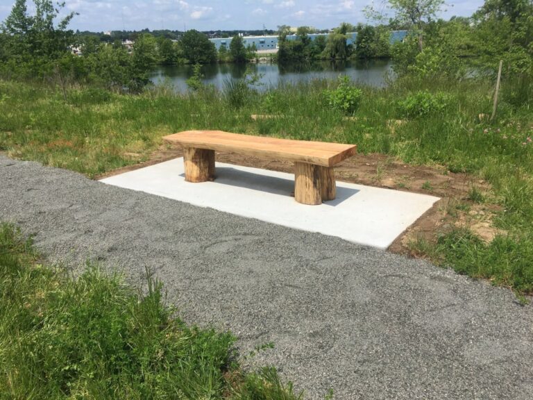 Photo showing a park bench at Mashapaug Park